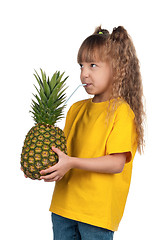 Image showing Little girl with pineapple