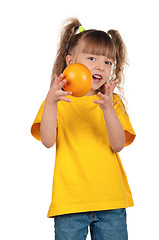 Image showing Little girl with grapefruit