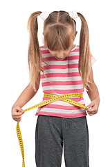 Image showing Little girl with measure