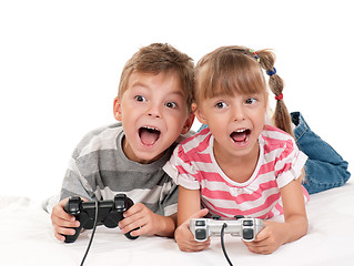 Image showing Happy girl and boy playing a video game