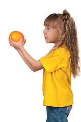 Image showing Little girl with grapefruit