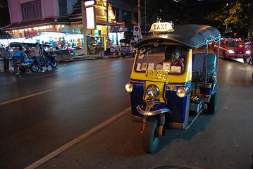 Image showing BANGKOK - AUG 10: A three wheeled tuk tuk taxi on a street in th