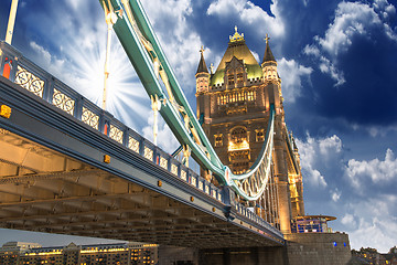 Image showing Famous Tower Bridge at sunset with clouds, seen from Tower of Lo