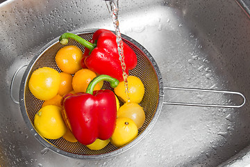 Image showing Washing colorful fruits and vegetables