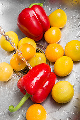 Image showing Washing red and yellow fruits and vegetables