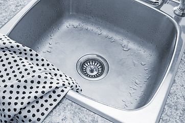 Image showing Clean sink and kitchen towel