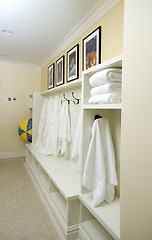 Image showing locker room with bathrobes towels