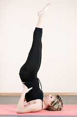 Image showing young woman doing yoga exercises