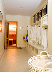 Image showing locker room with bathrobes towels