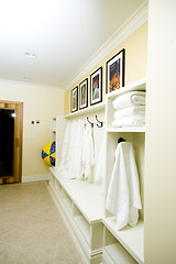 Image showing locker room with bathrobes towels