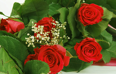 Image showing Bouquet of fresh red roses on white