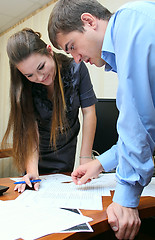 Image showing Girl and man working in the office