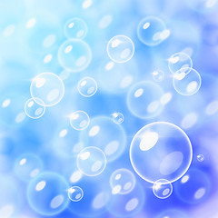 Image showing Blurred bubbles over blue