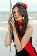 Image showing woman sitting on a swing