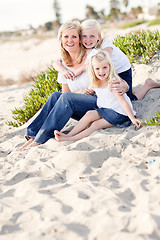 Image showing Pretty Mom and Her Cute Daughters at The Beach