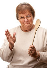 Image showing Upset Senior Woman with The Wooden Spoon