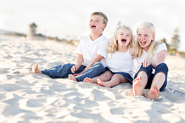 Image showing Cute Sibling Children Sitting at the Beach