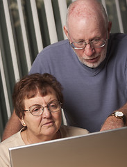 Image showing Smiling Senior Adult Couple Having Fun on the Computer