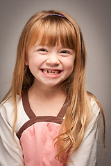 Image showing Fun Portrait of an Adorable Red Haired Girl on Grey