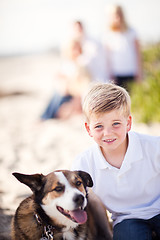 Image showing Handsome Young Boy Playing with His Dog