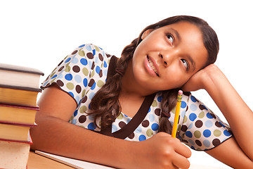 Image showing Pretty Hispanic Girl Studying and Daydreaming