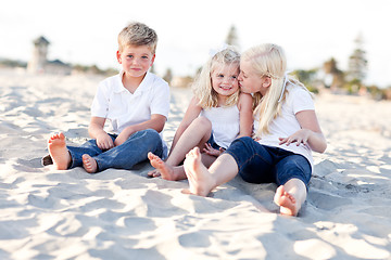 Image showing Adorable Sisters and Brother Having Fun at the Beach