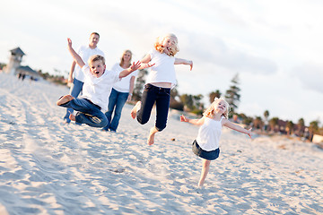 Image showing Happy Sibling Children Jumping for Joy