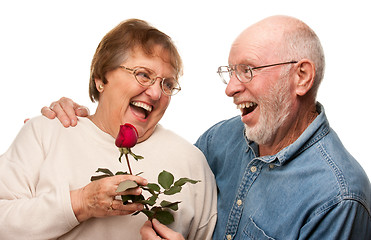 Image showing Happy Senior Husband Giving Red Rose to Wife
