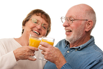 Image showing Happy Senior Couple with Glasses of Orange Juice