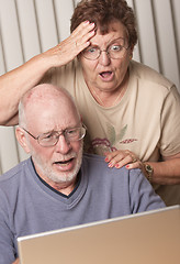 Image showing Smiling Senior Adult Couple Having Fun on the Computer