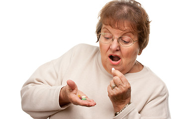 Image showing Attractive Senior Woman and Medication Pills
