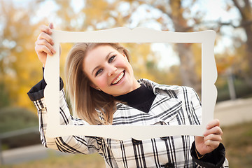 Image showing Pretty Young Woman Smiling in the Park with Picture Frame