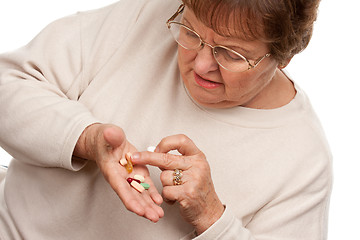 Image showing Attractive Senior Woman and Medication Pills
