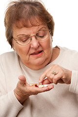 Image showing Attractive Senior Woman and Medication Pills
