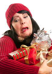 Image showing Attractive Woman Fumbling with Her Holiday Gifts
