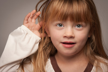 Image showing Fun Portrait of an Adorable Red Haired Girl on Grey