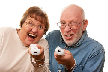 Image showing Happy Senior Couple Play Video Game with Remotes