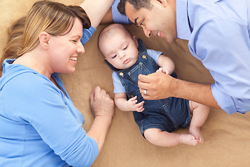 Image showing Mixed Race Family Playing on the Blanket