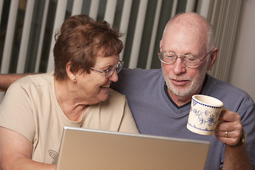 Image showing Smiling Senior Adult Couple Having Fun on the Computer