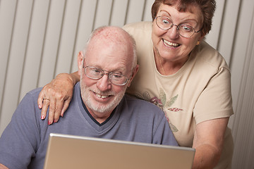 Image showing Smiling Senior Adult Couple Having Fun on the Computer