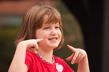 Image showing Adorable Girl Poses While Playing