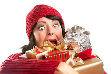 Image showing Attractive Woman Fumbling with Her Holiday Gifts