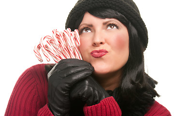 Image showing Pretty Young Woman Holding Candy Canes