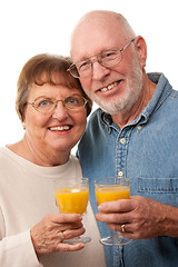 Image showing Happy Senior Couple with Glasses of Orange Juice