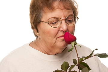 Image showing Attractive Senior Woman with Red Rose
