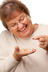 Image showing Attractive Senior Woman and Medication Pills
