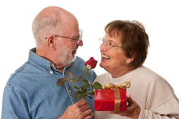 Image showing Happy Senior Couple with Gift and Red Rose