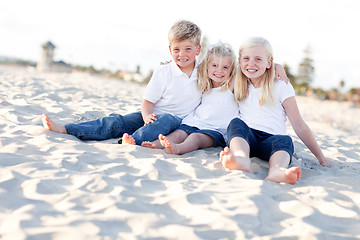 Image showing Adorable Sisters and Brother Having Fun at the Beach