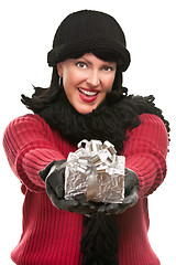 Image showing Pretty Young Woman Offering Holiday Gift