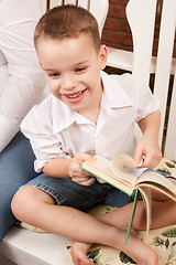 Image showing Cute Young Boy Reading His Book